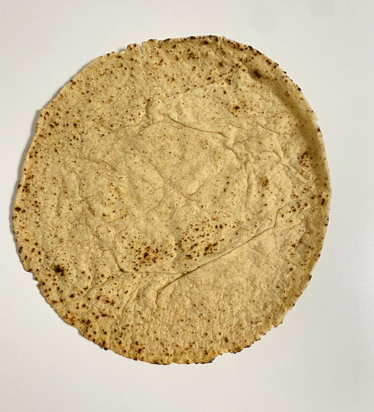 Picture - A high protein keto friendly tortilla wrap against a plain white background. 